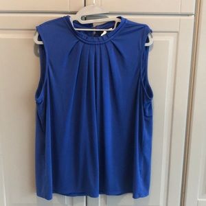 Blue sleeveless high neck blouse